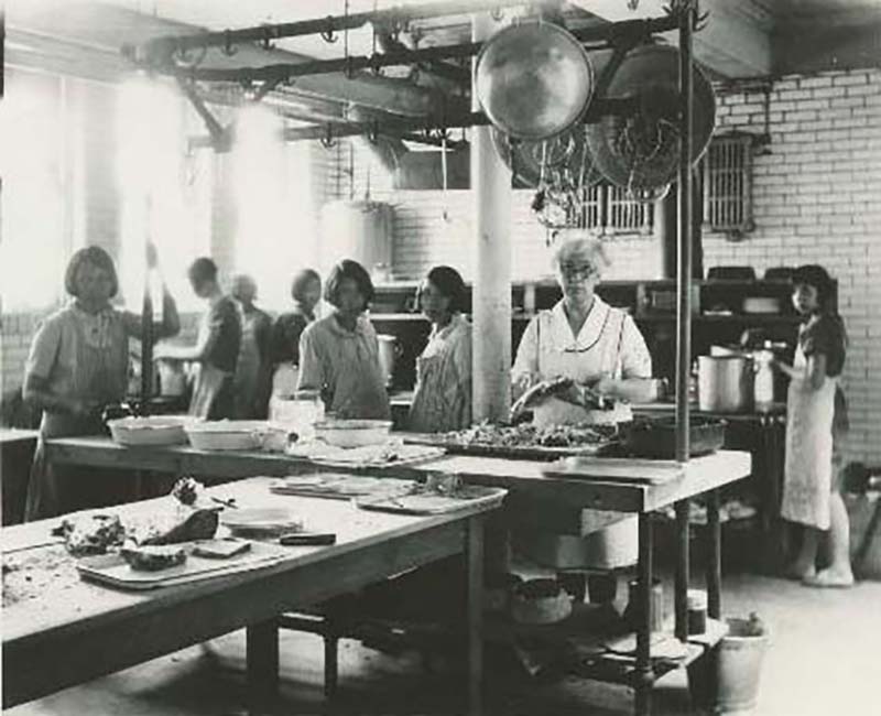 Group of students and teacher in kitchen at Edmonton Poundmaker school