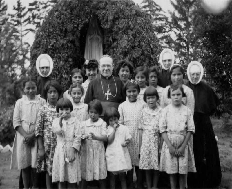 Group of students and teachers outside of Grouard St. Bernard's school 