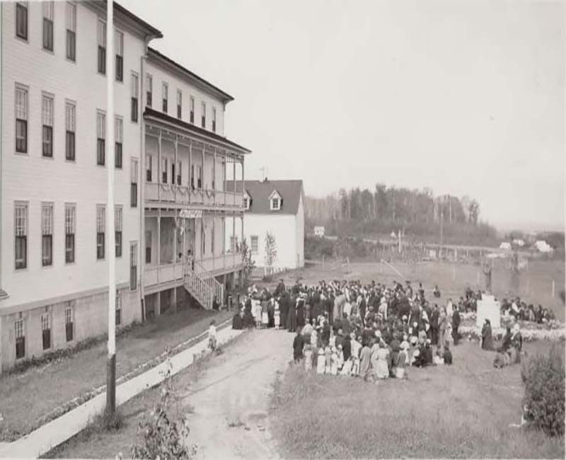Group of people outside at Joussard St. Brunos school