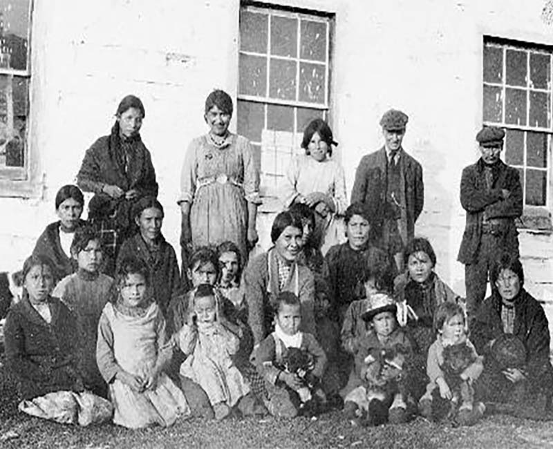 Group of people in front of Lac la Ronge school 