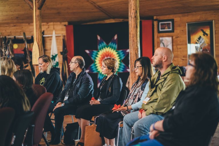 Group of people sitting at Turtle Lodge.
