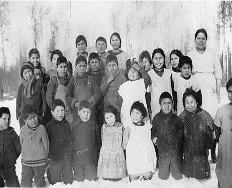 Group of students and teacher outside at Lesser Slave Lake school