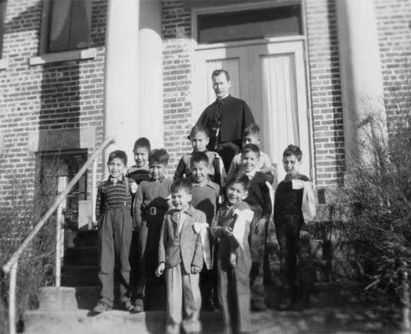 Students and teacher outside in front of Sechelt St. Augustines School