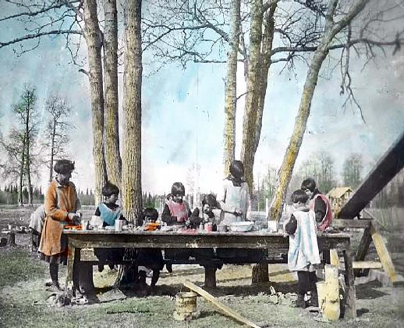 Children from Bishop Horden Hall school outside at table