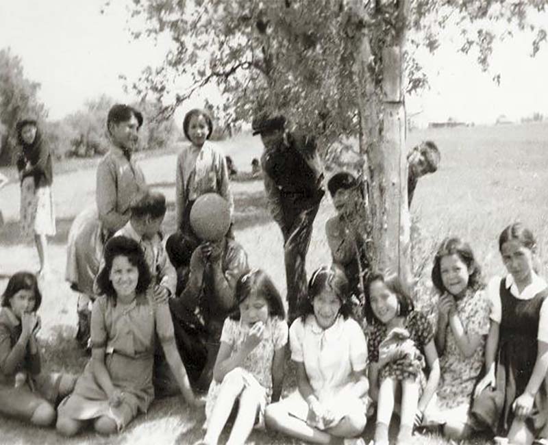 Group of people sitting outside from Elkhorn school