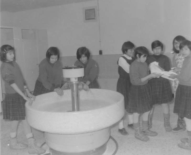 Students washing hands at Fort George Roman Catholic school