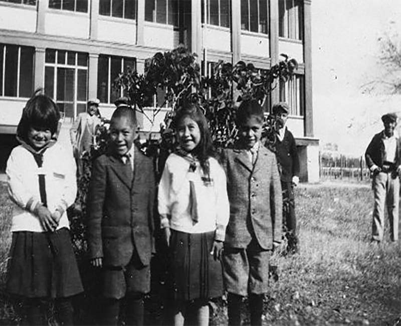 Group of students standing outside McKay school