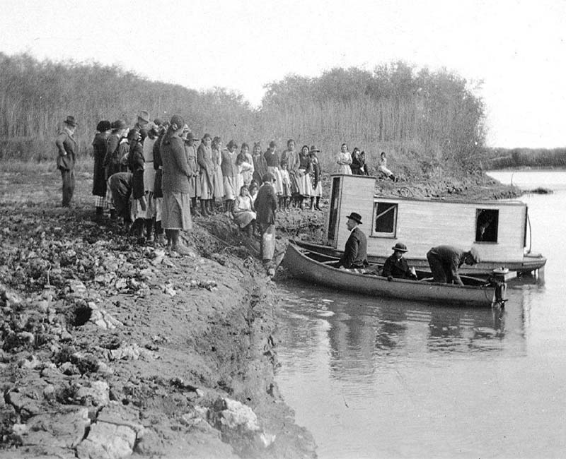 Group of students and teachers outside by lake from McKay school