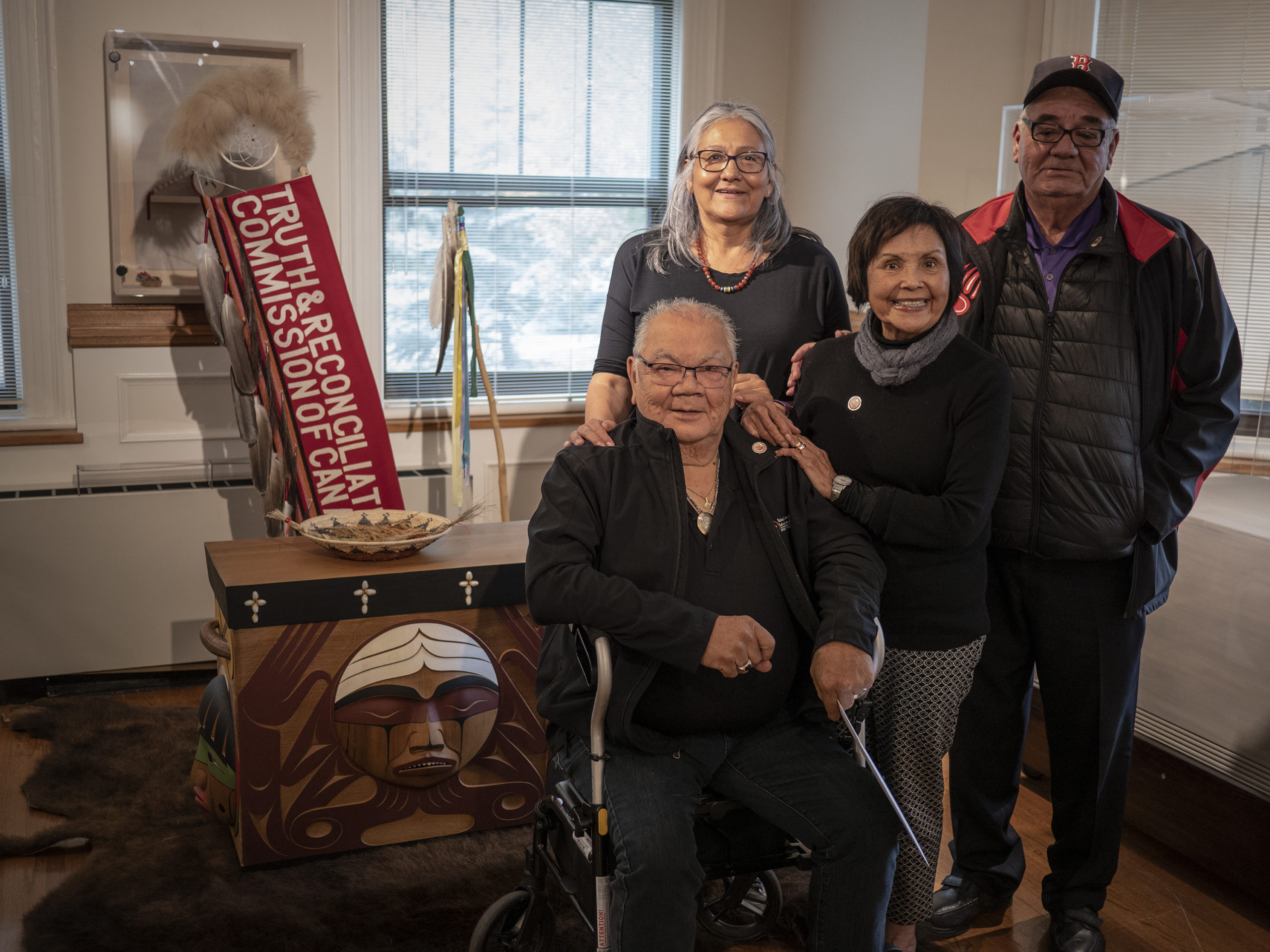 Survivors posing for photo by Bentwood Box