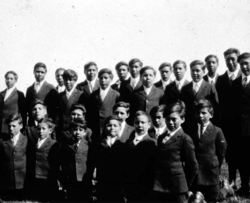 Group of students posed for picture outside of Sturgeon Landing school
