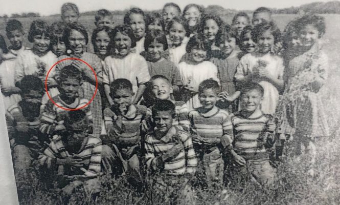 Eugene Arcand’s class picture from St. Michael’s. Eugene is circled in red.