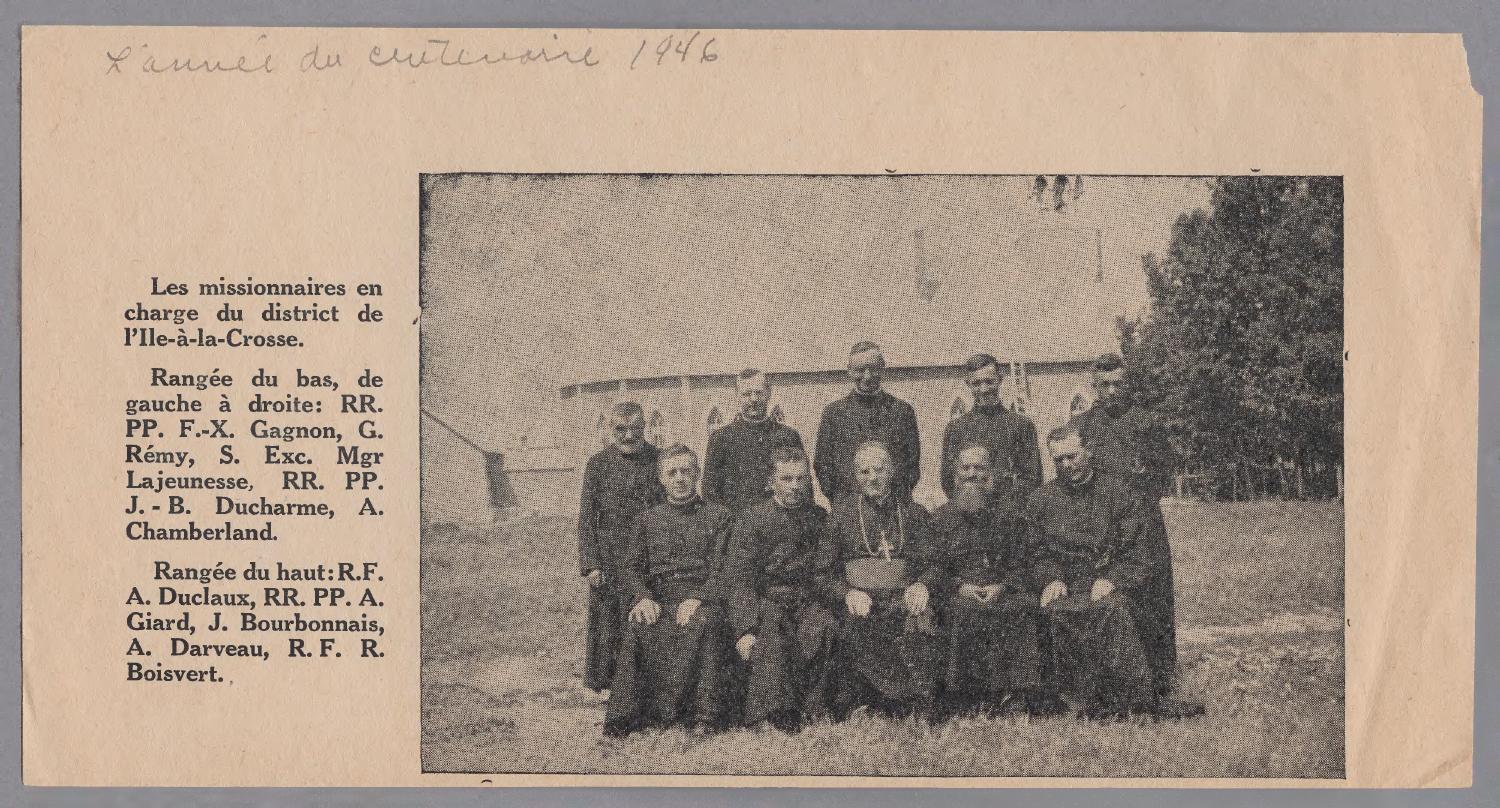 A group of 10 priests sit posed for a group photo. The photo appears to be cut from a newspaper.