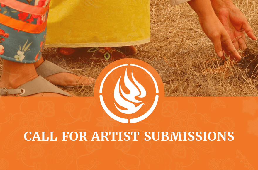 2 women wearing ribbon dresses standing in short dry grass