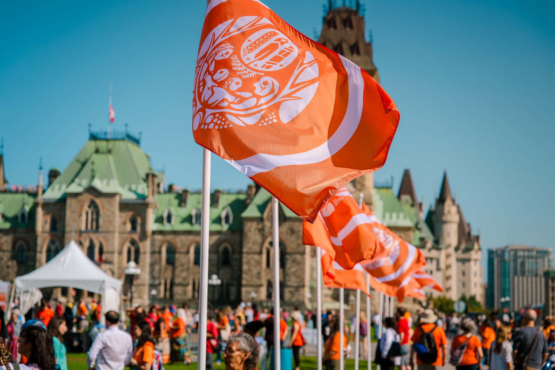Survivors’ Flag raised on Parliament Hill to honour residential school Survivors and the children who never came home